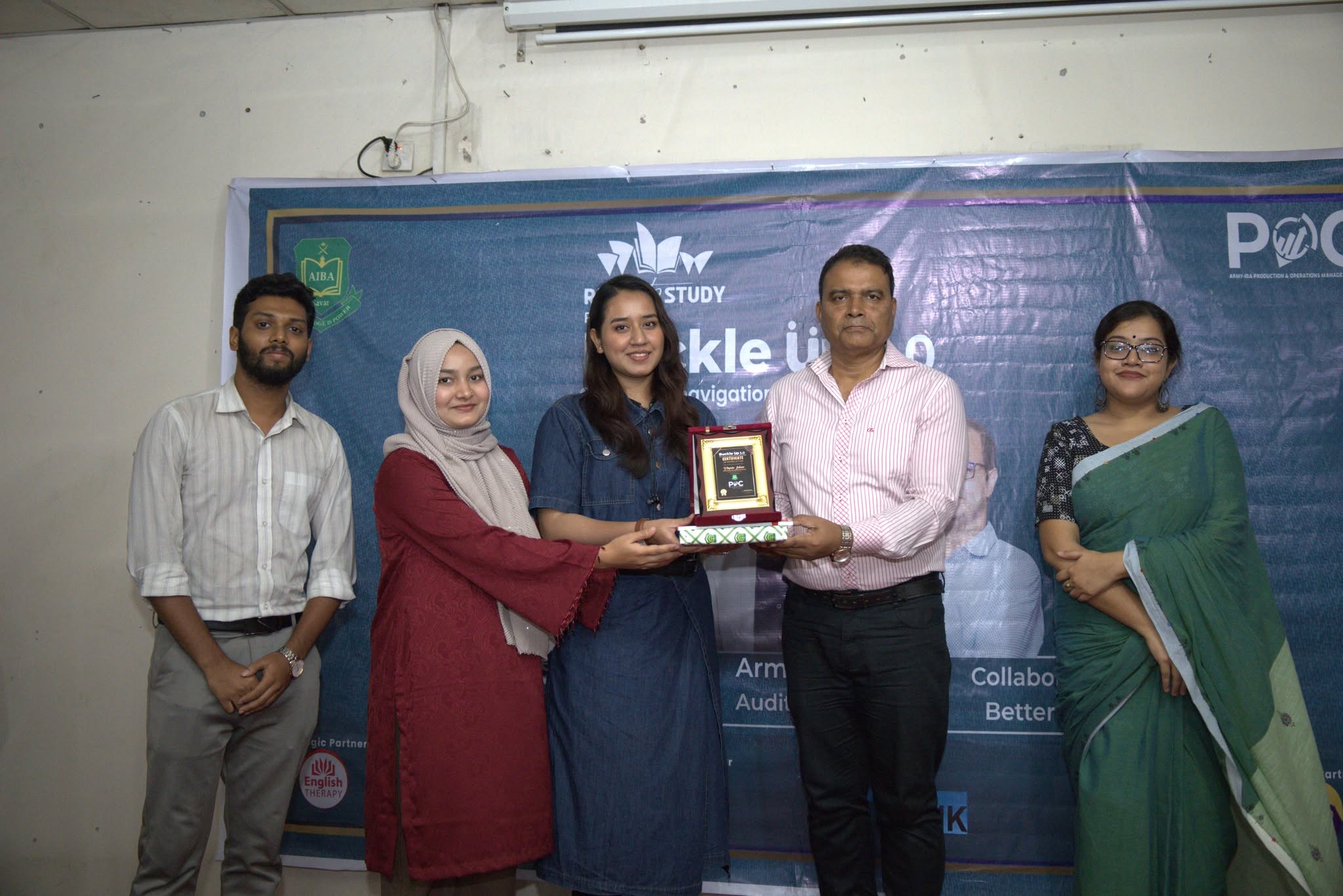 Ready to Study receiving a crest at the Buckle Up 3.0 seminar at Army IBA, Savar